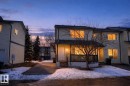 The property features a two-story exterior with light-colored siding and a covered front porch - 9 10909 106 Street, Edmonton, AB  - Outdoor 
