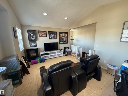 Living area featuring carpeting, recessed lighting, and a window with blinds - 21113 92A Avenue, Edmonton, AB - Indoor Photo Showing Other Room