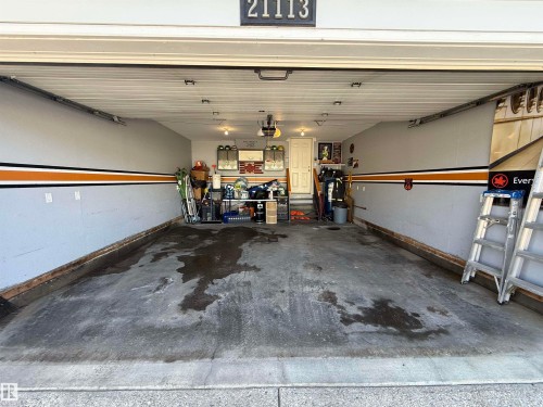 Spacious garage featuring painted walls and a concrete floor - 21113 92A Avenue, Edmonton, AB - Indoor Photo Showing Garage
