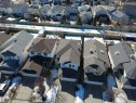 Aerial view showcasing the property's exterior, including a driveway, an attached garage, and a fenced rear yard - 21113 92A Avenue, Edmonton, AB  - Outdoor 