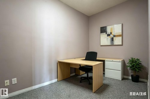 This versatile room features textured carpeting, light-colored walls, and a baseboard trim - 326 4304 139 Ave, Edmonton, AB - Indoor Photo Showing Office