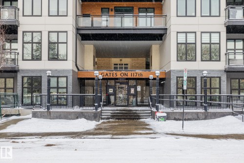 The property features a contemporary exterior with light-colored siding, dark window frames, and grey brick accents - 114 10531 117 Street, Edmonton, AB - Outdoor With Facade