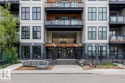 Contemporary multi-story building featuring a prominent main entrance - 