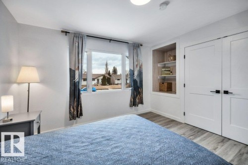 This room features light-toned flooring and white walls, creating a bright atmosphere - 6719 94B Avenue, Edmonton, AB - Indoor Photo Showing Bedroom