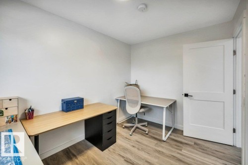 Room featuring light-colored walls and wood-look flooring - 6719 94B Avenue, Edmonton, AB - Indoor Photo Showing Office
