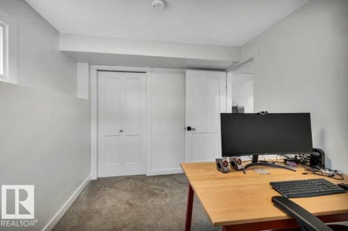 This room features carpeted flooring, light grey walls, and white trim - 6719 94B Avenue, Edmonton, AB - Indoor