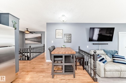 This property features hardwood flooring throughout the main living areas and a gray wall color - 17819 91A Street, Edmonton, AB - Indoor