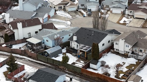 The property offers a sizable backyard with a shed and a deck - 17819 91A Street, Edmonton, AB - Outdoor