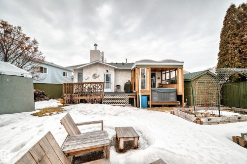The property features a rear deck, an enclosed patio area, and a green shed - 17819 91A Street, Edmonton, AB - Outdoor With Deck Patio Veranda