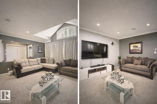 This living space features light-colored carpeting, recessed lighting, and a vaulted ceiling with an arched window - 6712 18 Ave Sw Sw, Edmonton, AB - Indoor Photo Showing Living Room