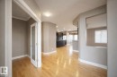 The property features light hardwood flooring and neutral paint throughout - 6712 18 Ave Sw Sw, Edmonton, AB  - Indoor Photo Showing Other Room 