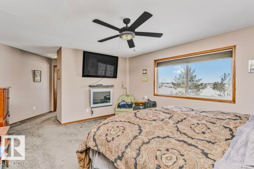37 Wedgewood, Fort Saskatchewan, AB - Indoor Photo Showing Bedroom With Fireplace