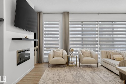 1091 Secord Promenade, Edmonton, AB - Indoor Photo Showing Other Room With Fireplace