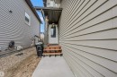 The property features a front entrance with a porch and steps, a white door, and light-colored siding - 2314 22 Avenue, Edmonton, AB  - Outdoor With Exterior 