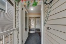 Inviting entryway featuring a white paneled door with a glass insert, leading to an interior with dark flooring - 2314 22 Avenue, Edmonton, AB  - Outdoor With Exterior 