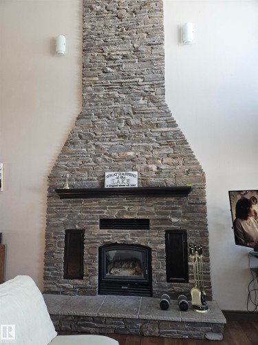 Wood Burning Fireplace - 4413 53 Street, St. Paul Town, AB - Indoor Photo Showing Living Room With Fireplace