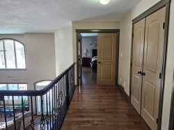 View upstairs towards Primary Bedroom - 