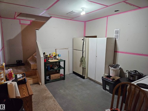 Basement area near stairs leading to outside, separate entrance for future use or further storage - 4413 53 Street, St. Paul Town, AB - Indoor Photo Showing Other Room