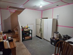 Basement area near stairs leading to outside, separate entrance for future use or further storage - 