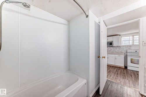 Bathroom featuring a showerhead, a shower curtain rod, and a bathtub - 12411 126 Street Nw, Edmonton, AB - Indoor Photo Showing Bathroom