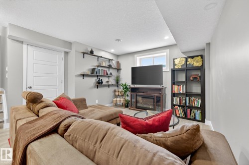 8061 Chappelle Way, Edmonton, AB - Indoor Photo Showing Living Room With Fireplace