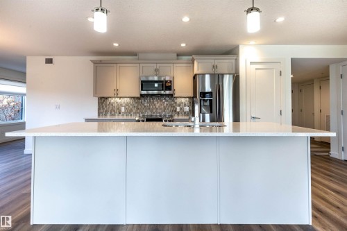 108 5025 Edgemont Boulevard, Edmonton, AB - Indoor Photo Showing Kitchen With Upgraded Kitchen