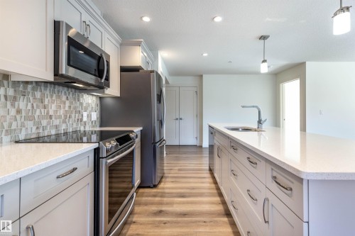 108 5025 Edgemont Boulevard, Edmonton, AB - Indoor Photo Showing Kitchen With Upgraded Kitchen