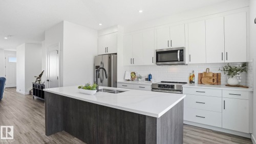 10 Meadowview Way, Leduc, AB - Indoor Photo Showing Kitchen With Stainless Steel Kitchen With Double Sink With Upgraded Kitchen