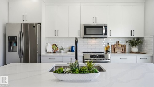 10 Meadowview Way, Leduc, AB - Indoor Photo Showing Kitchen With Stainless Steel Kitchen With Upgraded Kitchen
