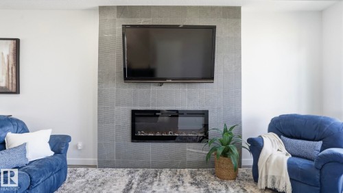 10 Meadowview Way, Leduc, AB - Indoor Photo Showing Living Room With Fireplace