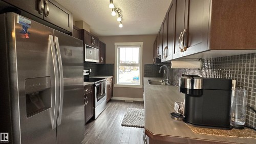 315 401 Southfork Drive, Leduc, AB - Indoor Photo Showing Kitchen With Double Sink
