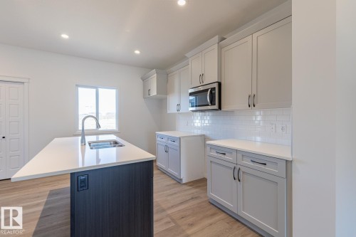219 Wattle Road, Leduc, AB - Indoor Photo Showing Kitchen With Double Sink