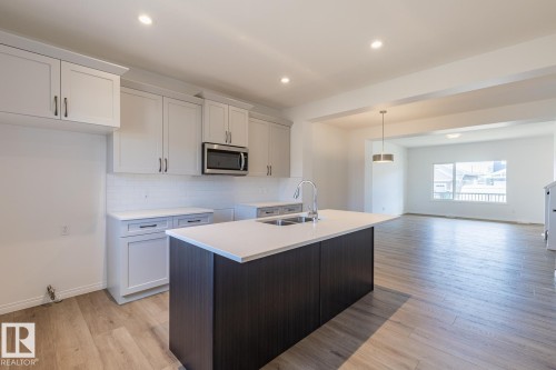 219 Wattle Road, Leduc, AB - Indoor Photo Showing Kitchen With Double Sink