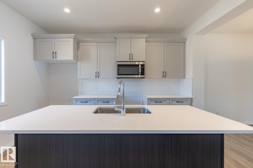 219 Wattle Road, Leduc, AB - Indoor Photo Showing Kitchen With Double Sink