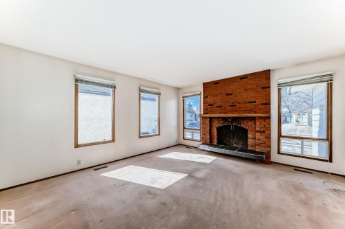 14237 22A Street, Edmonton, AB - Indoor Photo Showing Living Room With Fireplace