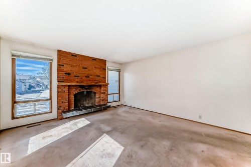 14237 22A Street, Edmonton, AB - Indoor Photo Showing Living Room With Fireplace