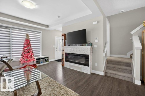 994 Berg Place, Leduc, AB - Indoor Photo Showing Living Room With Fireplace