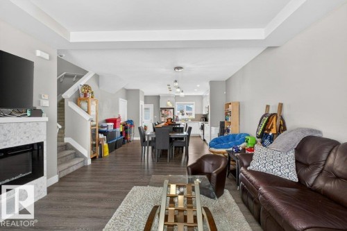 994 Berg Place, Leduc, AB - Indoor Photo Showing Living Room With Fireplace