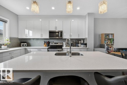 994 Berg Place, Leduc, AB - Indoor Photo Showing Kitchen With Stainless Steel Kitchen With Double Sink With Upgraded Kitchen