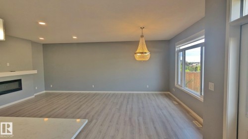 2318 Cassidy Way, Edmonton, AB - Indoor Photo Showing Other Room With Fireplace