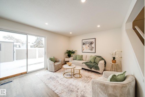 Living area featuring recessed lighting, light-colored walls, and light-toned flooring - 125 Woodborough Way, Edmonton, AB - Indoor Photo Showing Living Room