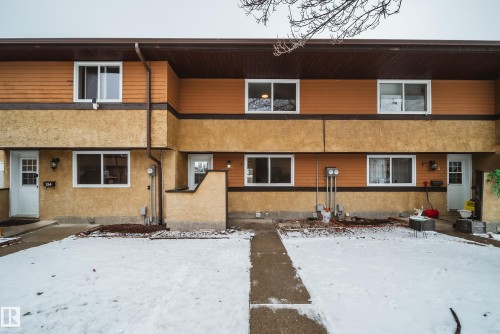 This property features a multi-level exterior with a combination of textured stucco and horizontal siding - 125 Woodborough Way, Edmonton, AB - Outdoor