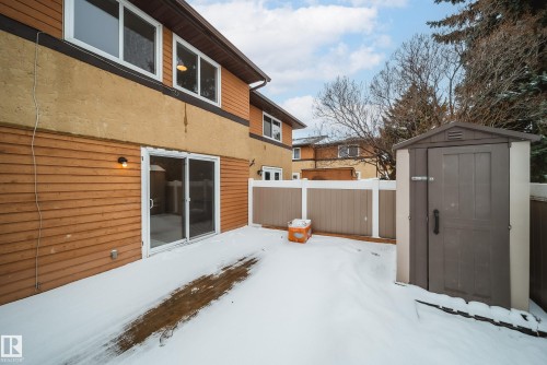 The property features a private fenced yard with a storage shed - 125 Woodborough Way, Edmonton, AB - Outdoor With Exterior