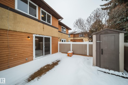 The property features a private fenced yard with a storage shed and a deck - 125 Woodborough Way, Edmonton, AB - Outdoor With Exterior