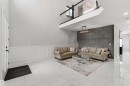 This living area features a high ceiling, white tile flooring, and wainscoting - 1520 151 Avenue, Edmonton, AB  - Indoor 
