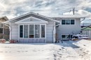 The property features light-colored horizontal siding and a prominent bay window - 16305 107A Ave, Edmonton, AB  - Outdoor 