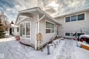 The property features a light-colored exterior with a bay window and multiple windows, providing natural light - 16305 107A Ave, Edmonton, AB  - Outdoor 
