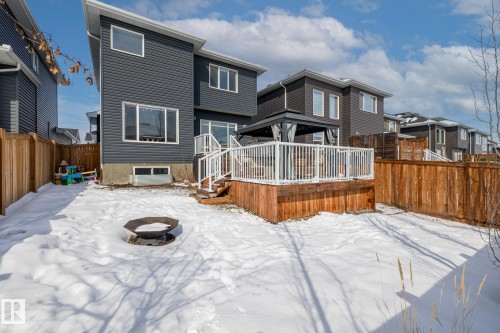 The property features a spacious backyard with a wooden deck, white railings, and a gazebo - 3864 Robins Crescent, Edmonton, AB - Outdoor With Deck Patio Veranda With Exterior