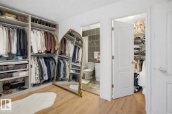 This room features built-in closet organizers with hanging rods and shelving - 