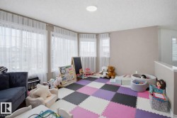 The property features a bright room with light-colored walls and a ceiling light fixture - 